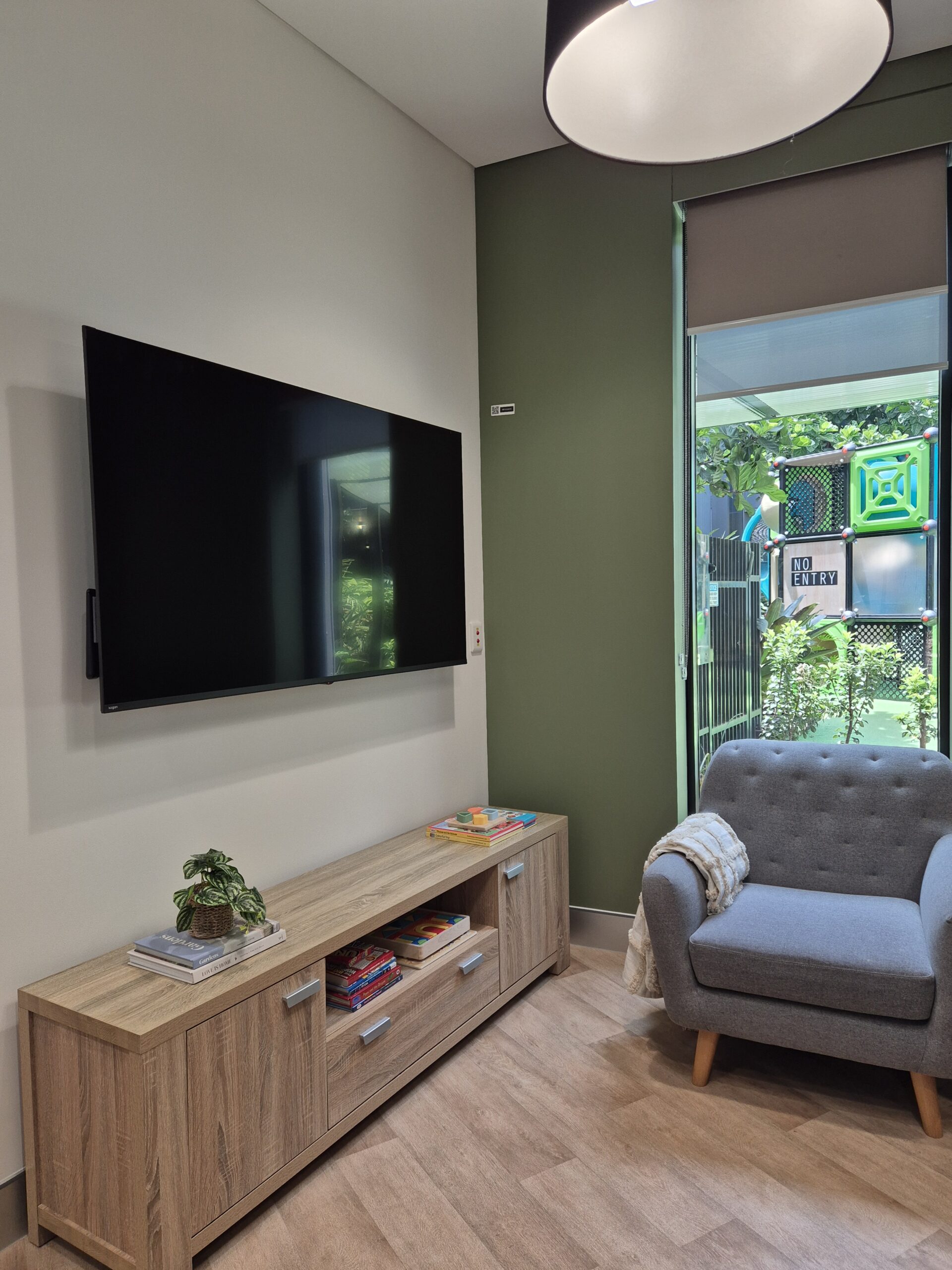 Comfortable armchair and a TV in the Ronald McDonald House Greater Western Sydney Family Room, The Children's Hospital at Westmead