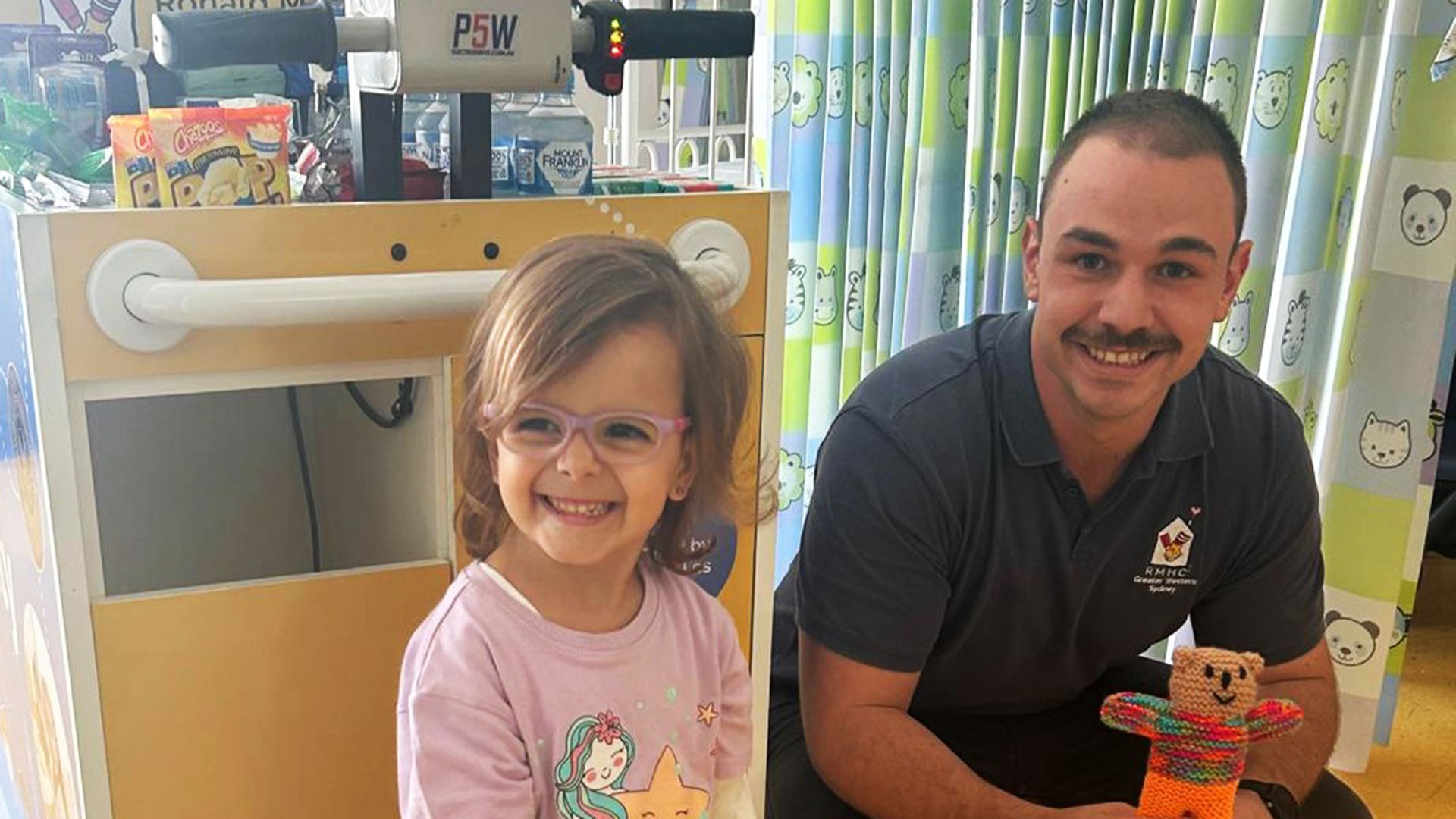 Ronald McDonald House Greater Western Sydney Hospitality Cart Volunteer at Nepean Hospital with a child