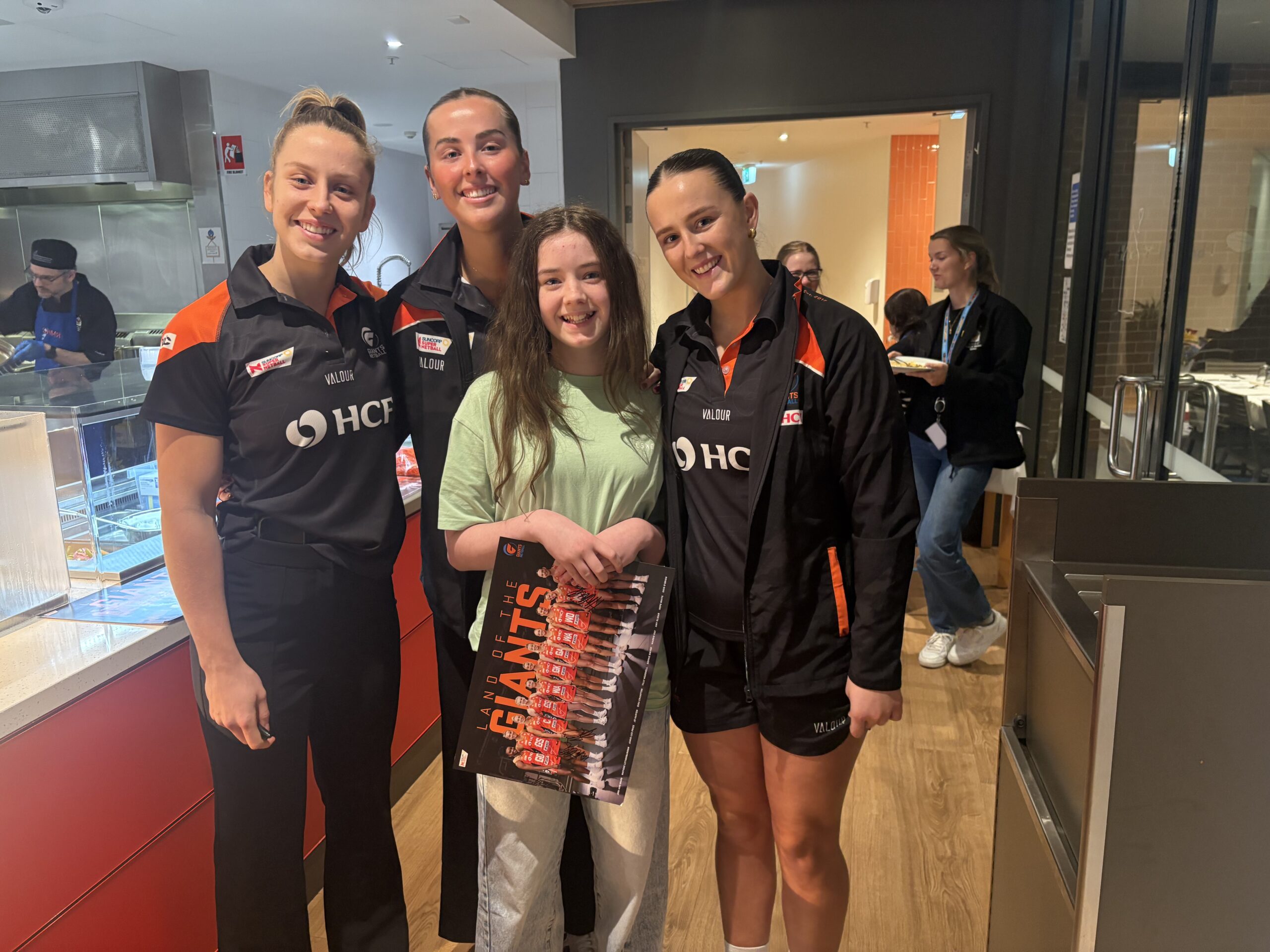 Young girl supported by Ronald McDonald House Greater Western Sydney, pictured here with GIANTS Netball players