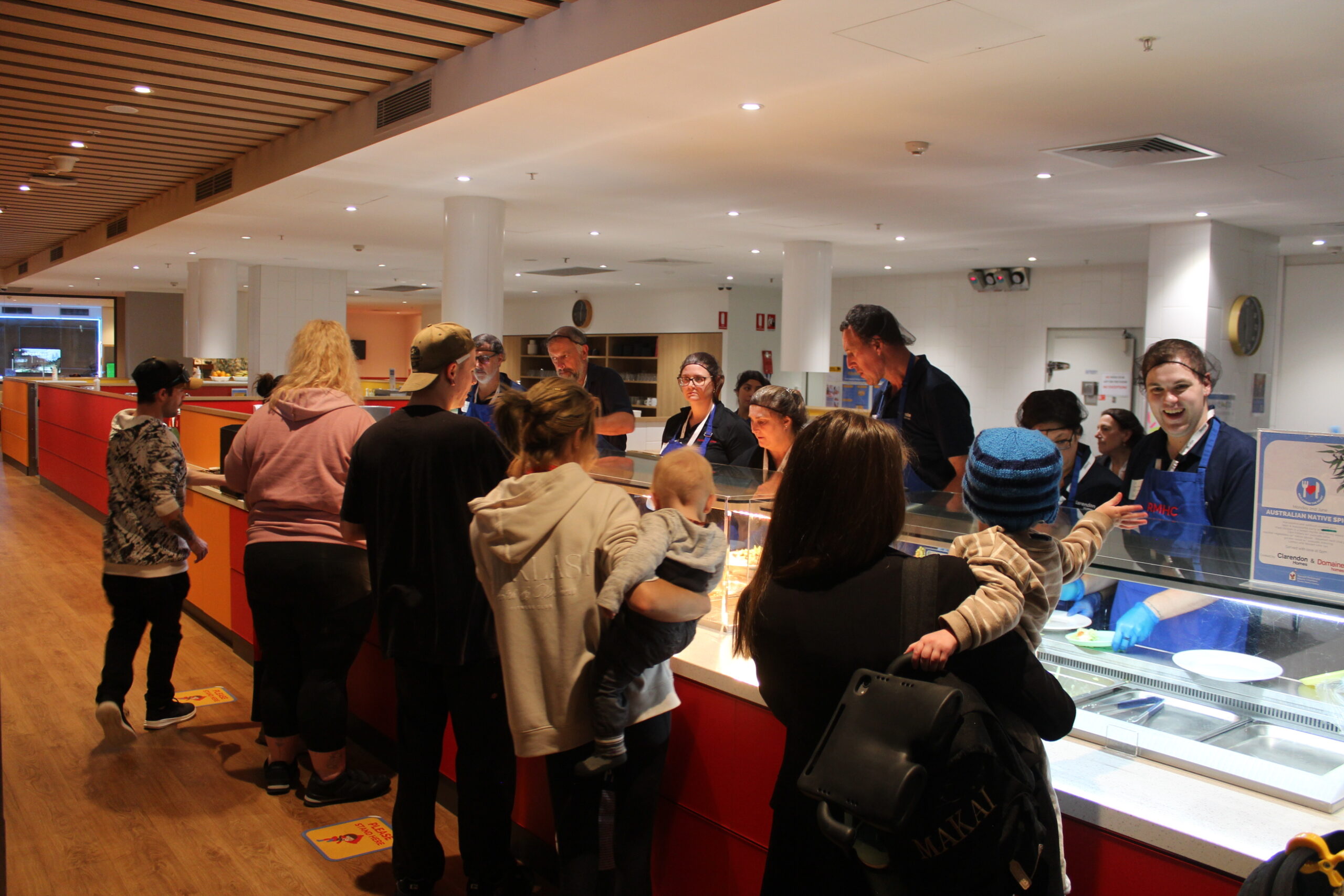 Campbell Property Group (CPG) at Ronald McDonald House Greater Western Sydney Westmead serving dinner to families as part of the Meals from the Heart group volunteering program